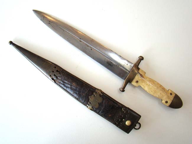 A 19th century bone handled Knife with its' original brass mounted leather sheath circa 1830-1860